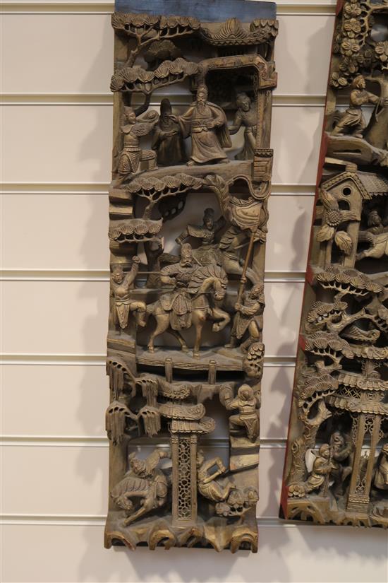 Four Chinese carved giltwood panels of battle scenes